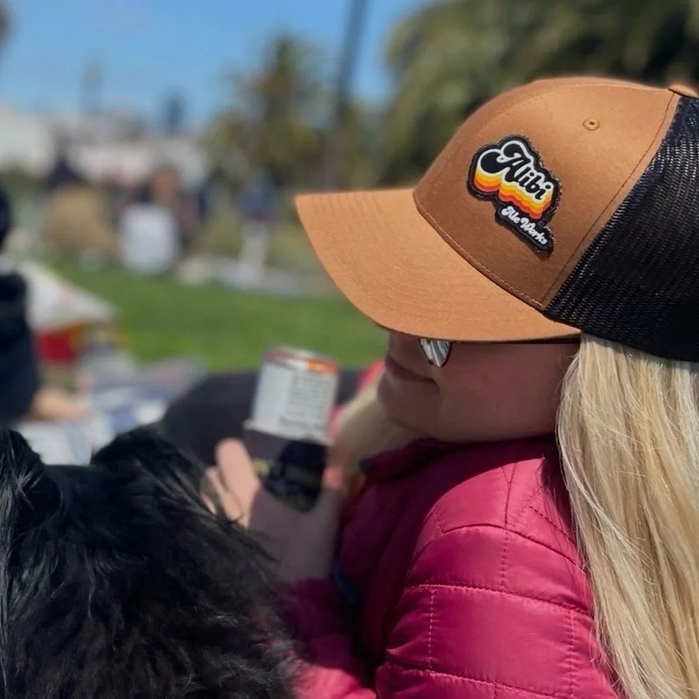 Alibi Ale Works Trucker Hat – Brown & Black Mesh (Adjustable)